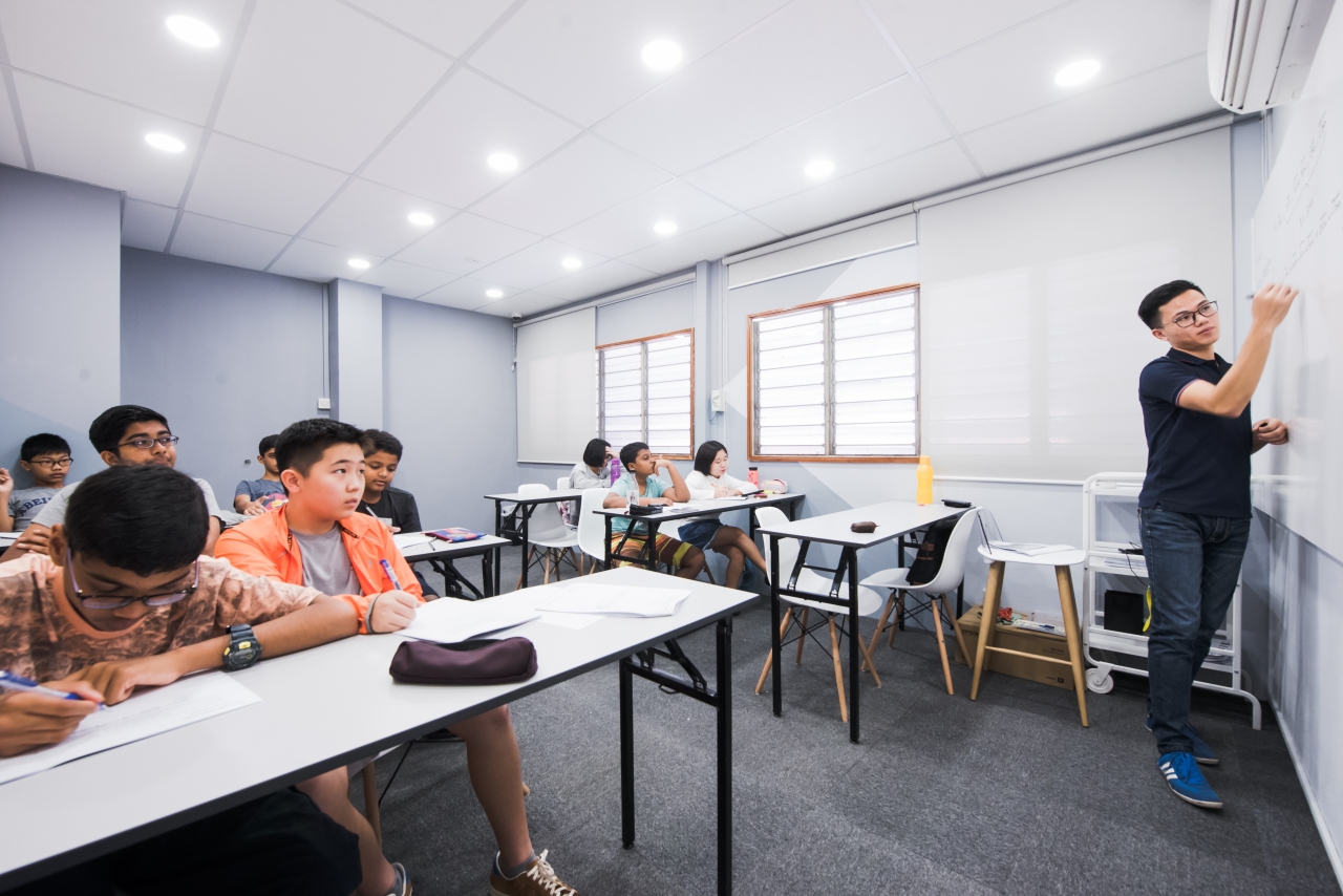 A brightly-lit classroom that keeps students awake at a math olympiad tuition centre
