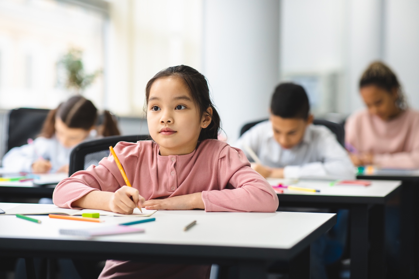 Kids in a classroom doing a math competition preparation